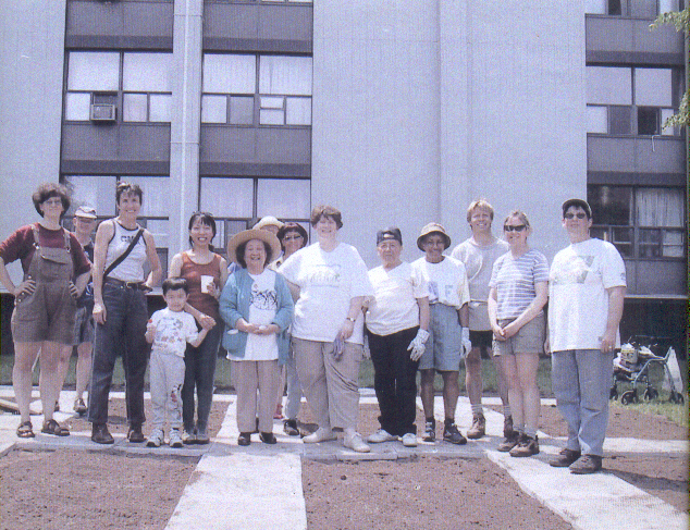 volunteerswhobuiltpavedstonewalkandraisedplots.jpg